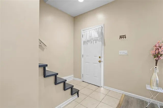 a view of an entryway with wooden floor