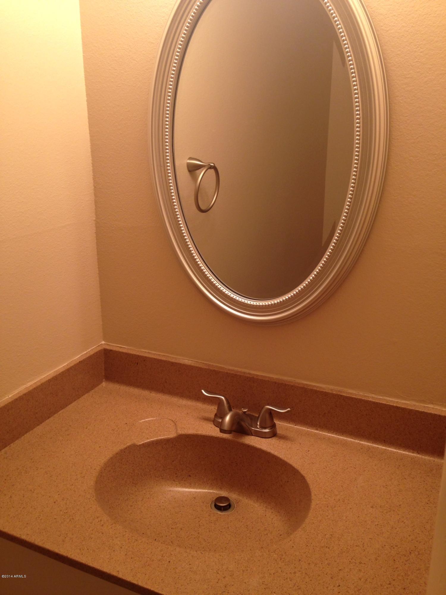 6829 East Osborn Road, Unit B Scottsdale, AZ 85251 - Photo 11 of 20 a bathroom with a sink and mirror