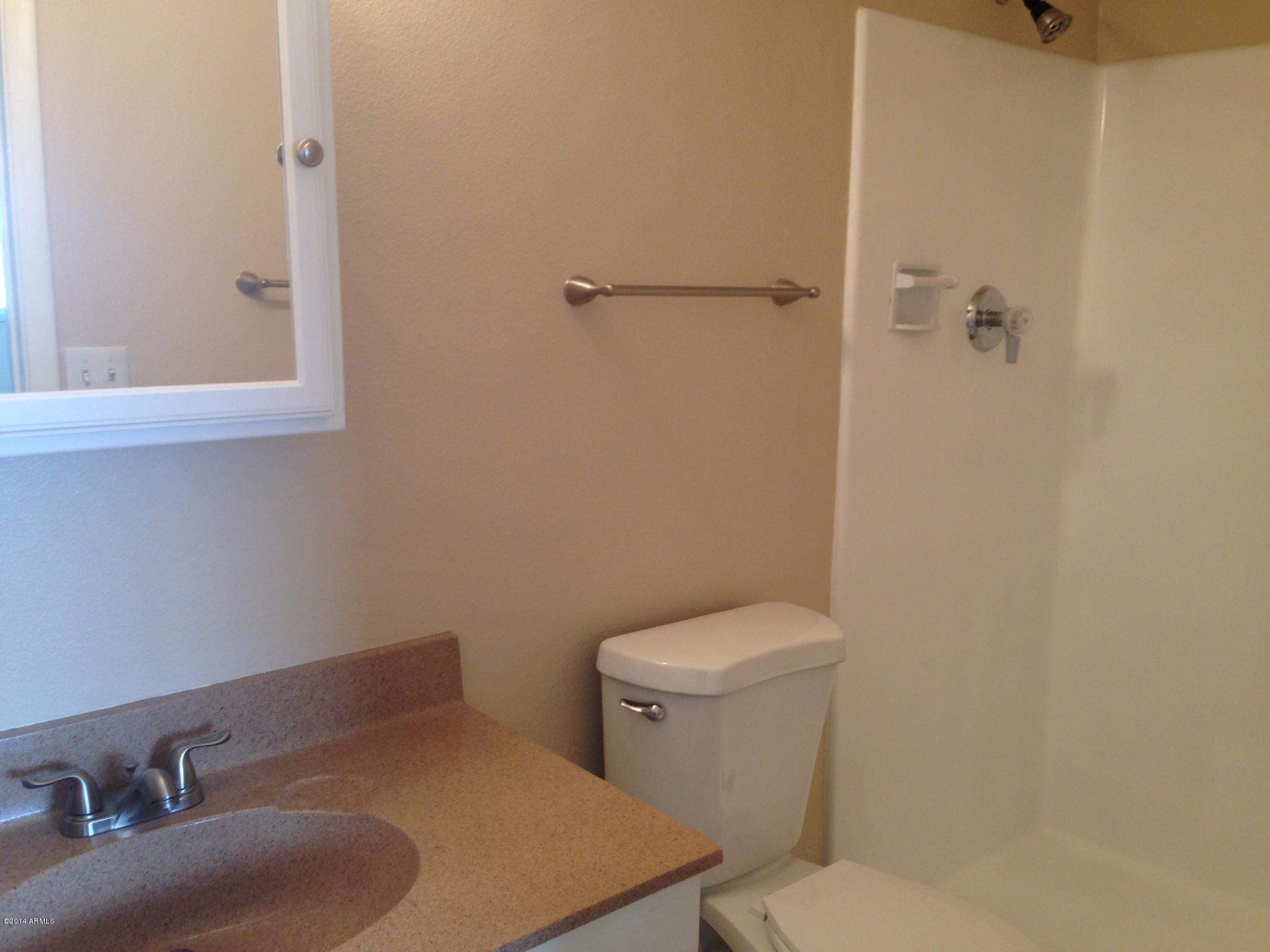 6829 East Osborn Road, Unit B Scottsdale, AZ 85251 - Photo 13 of 20 a bathroom with a sink and a toilet