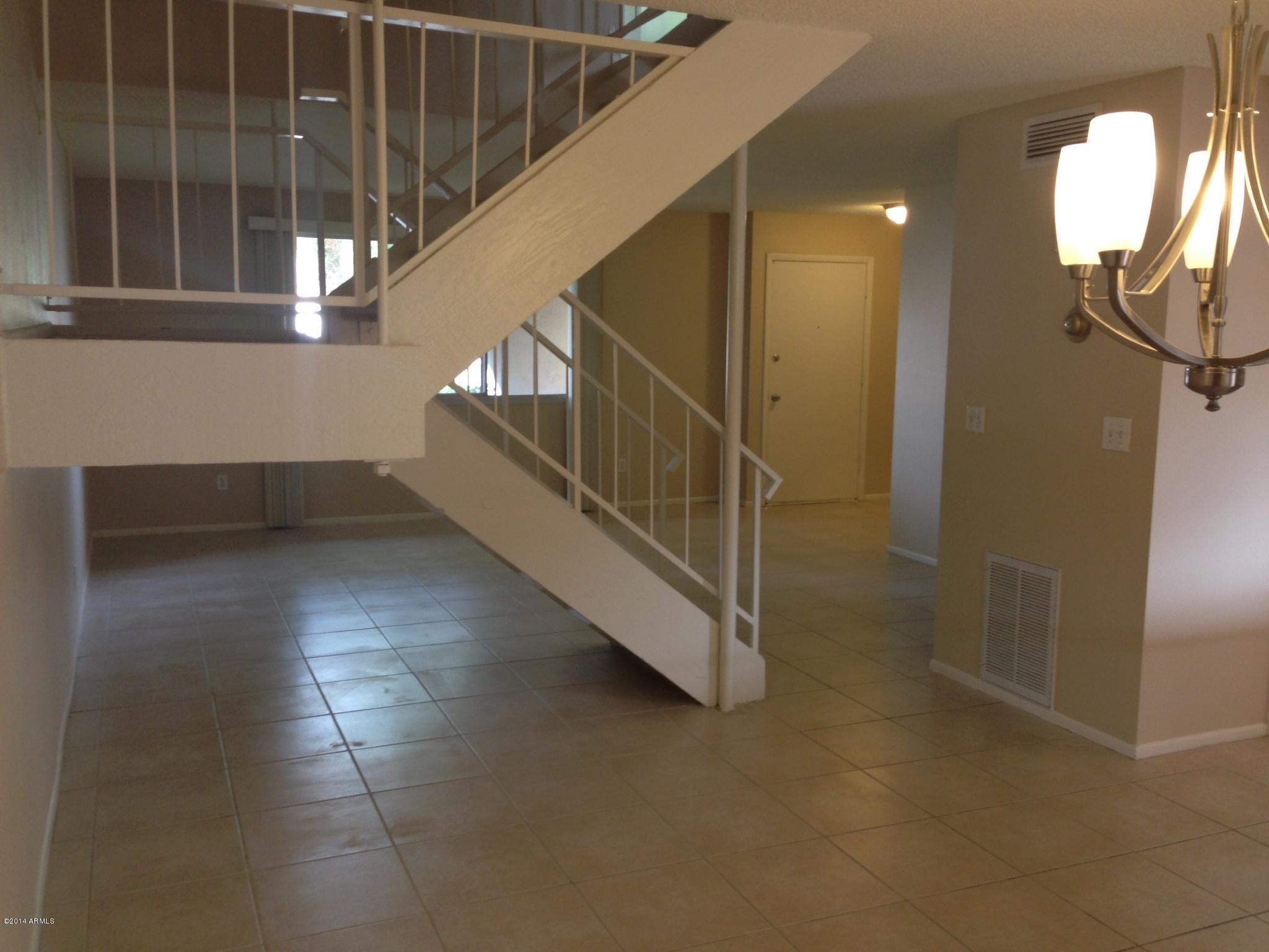 6829 East Osborn Road, Unit B Scottsdale, AZ 85251 - Photo 10 of 20 a view of entryway and hall with a front door