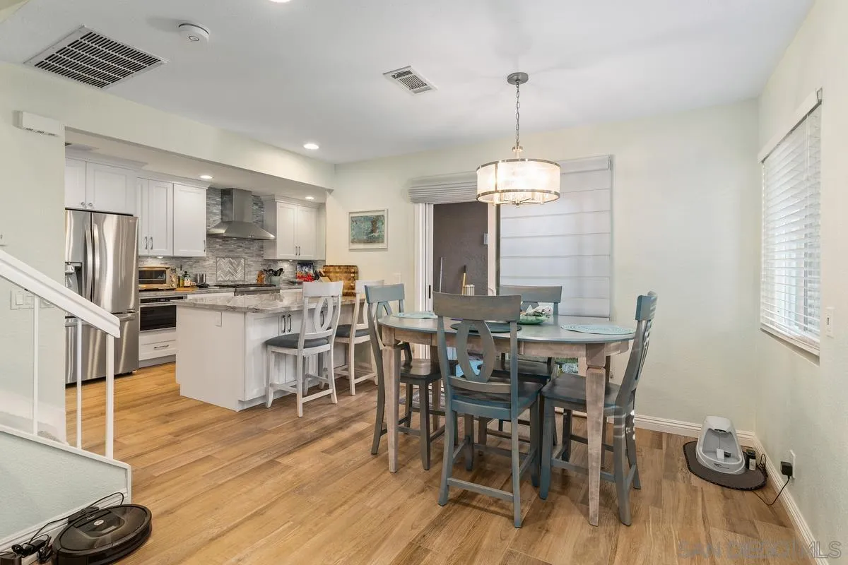 13350 Birch Tree Lane Poway, CA 92064 - Photo 11 of 43 a view of a dining room with furniture window and wooden floor