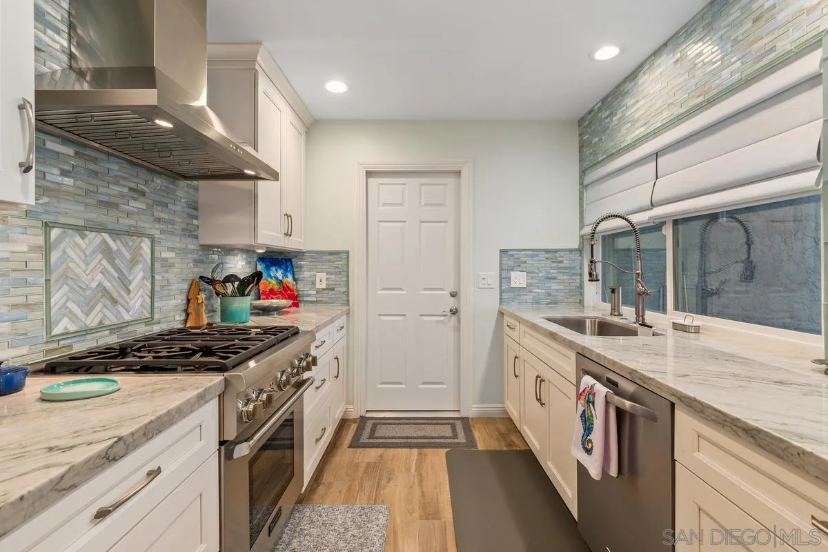 13350 Birch Tree Lane Poway, CA 92064 - Photo 15 of 43 a kitchen with stainless steel appliances granite countertop a sink and a stove