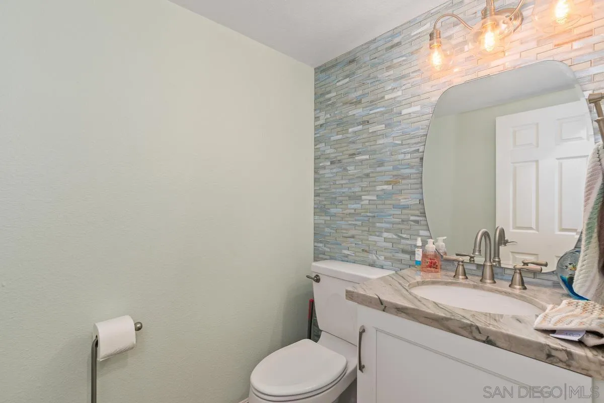 13350 Birch Tree Lane Poway, CA 92064 - Photo 18 of 43 a bathroom with a granite countertop toilet sink and mirror