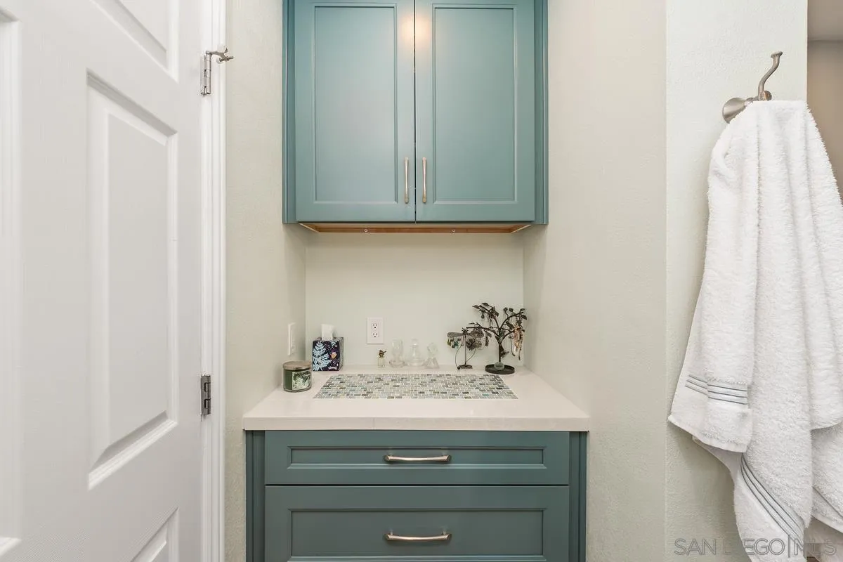 13350 Birch Tree Lane Poway, CA 92064 - Photo 23 of 43 a bathroom with a sink and a mirror