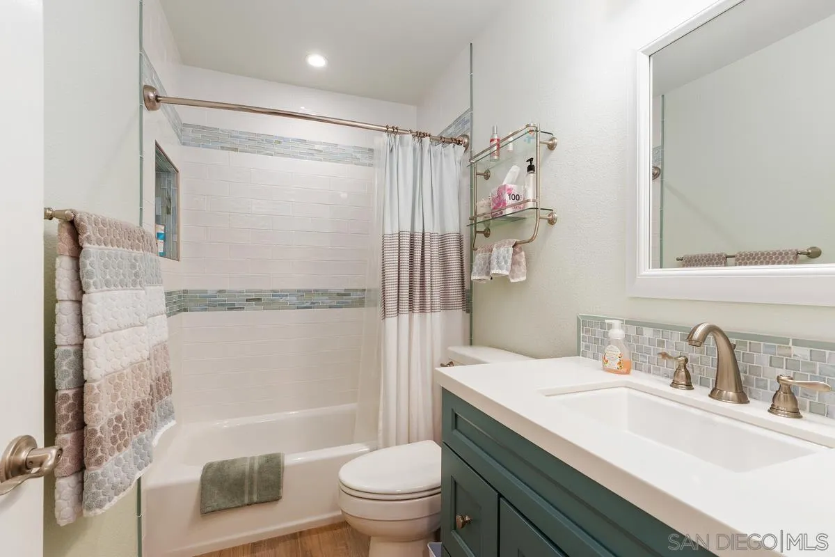 13350 Birch Tree Lane Poway, CA 92064 - Photo 26 of 43 a bathroom with a sink a toilet and shower