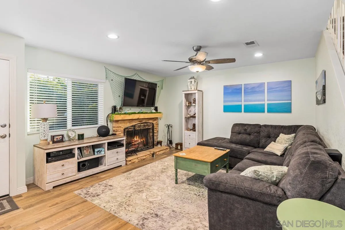 13350 Birch Tree Lane Poway, CA 92064 - Photo 9 of 43 a living room with furniture fireplace and a flat screen tv
