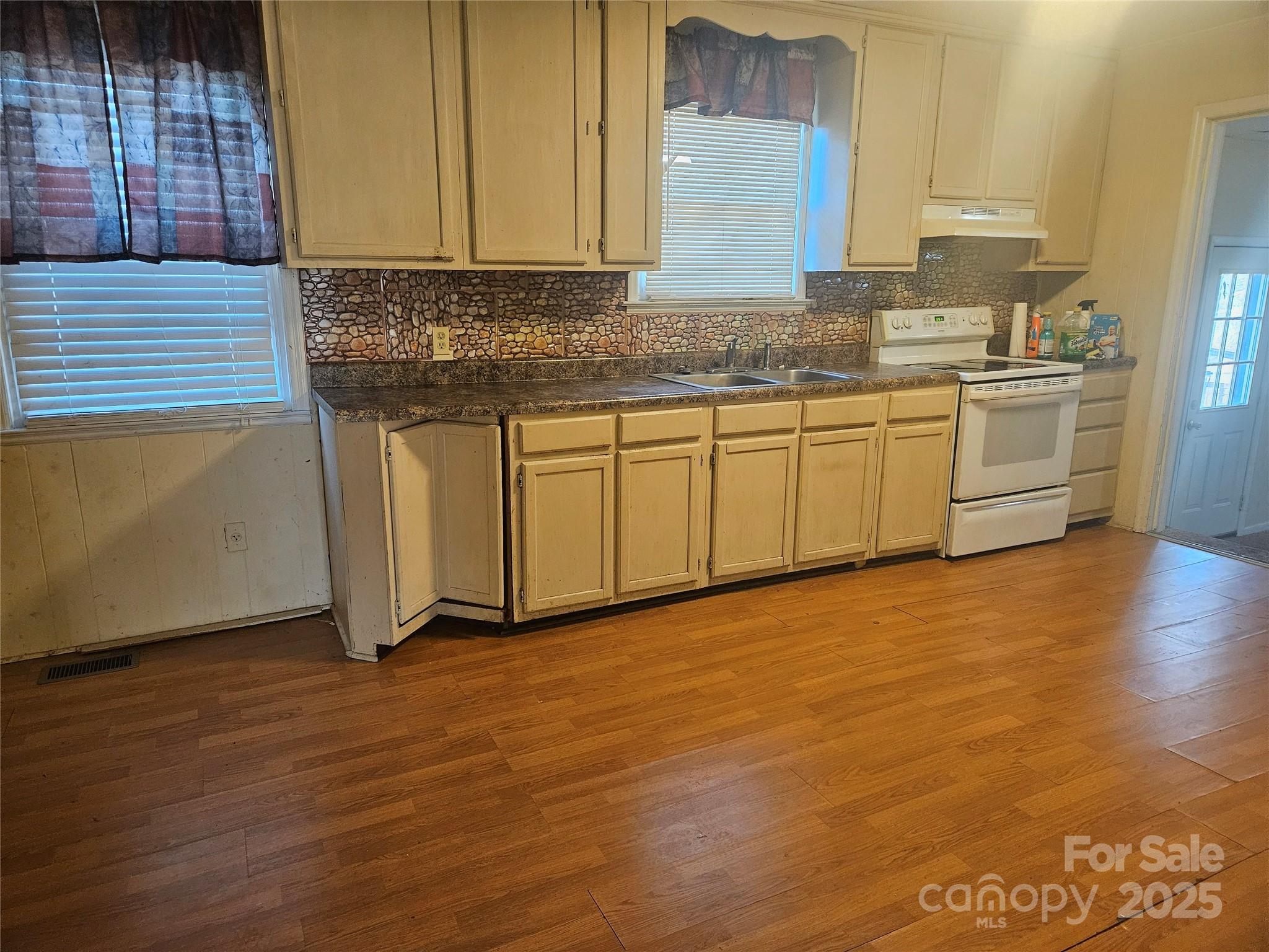 3406 West End Road Carlisle, SC 29031 - Photo 4 of 13 a kitchen with granite countertop a sink and cabinets