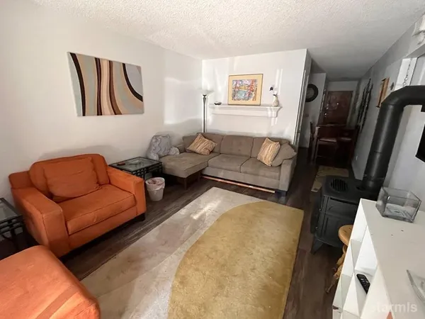 a living room with furniture or couch and a flat screen tv