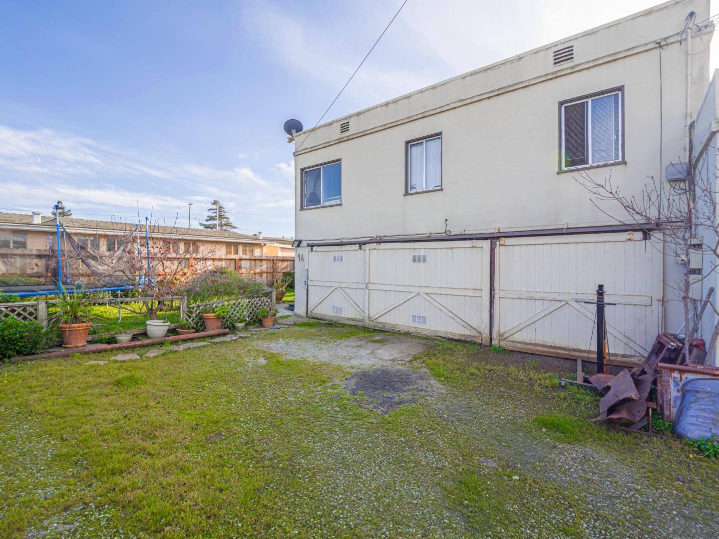 9 Memorial Avenue Freedom, CA 95019 - Photo 18 of 18 a view of a backyard with plants and brick wall