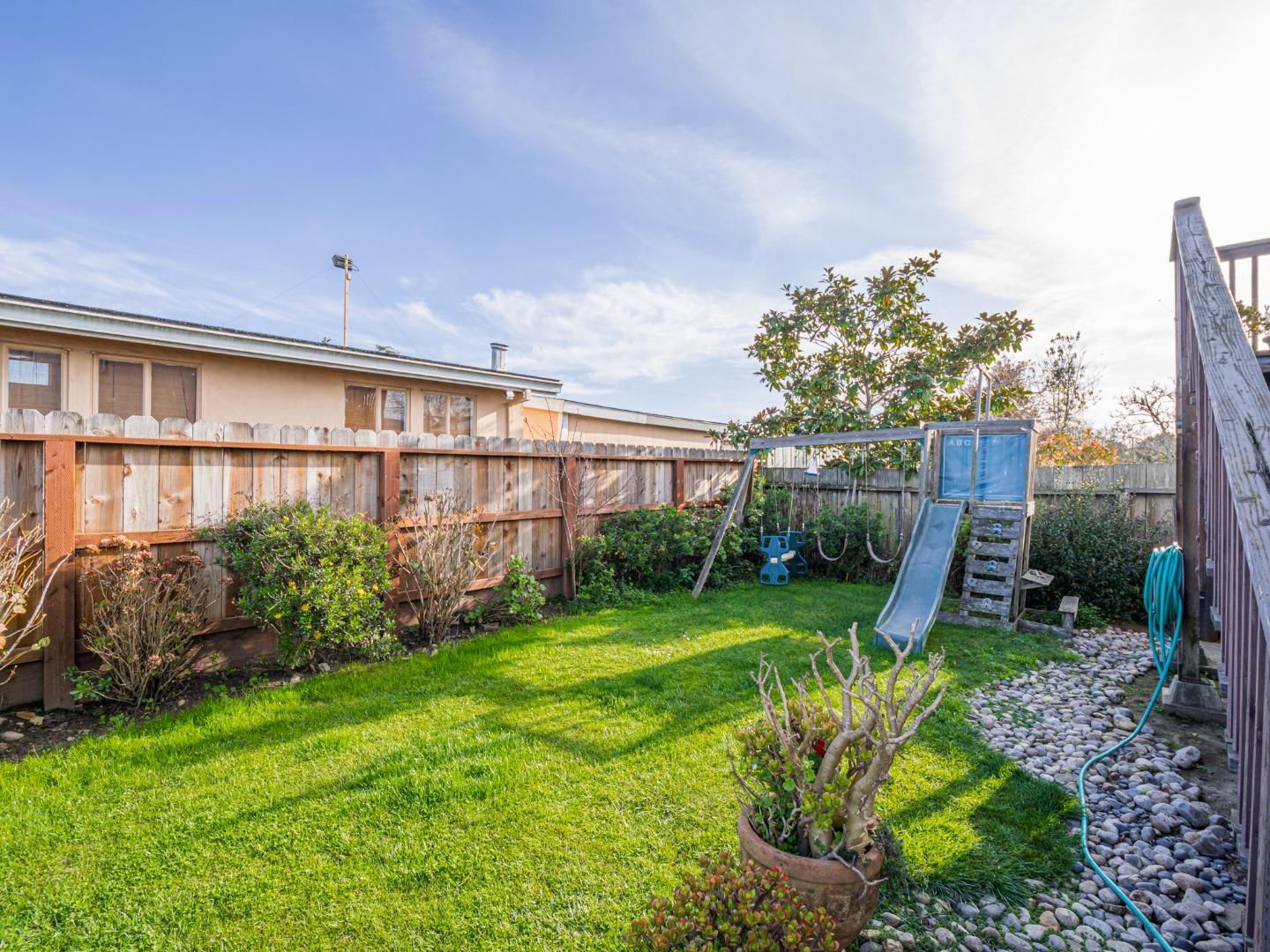 9 Memorial Avenue Freedom, CA 95019 - Photo 2 of 18 a view of a house with a yard and plants