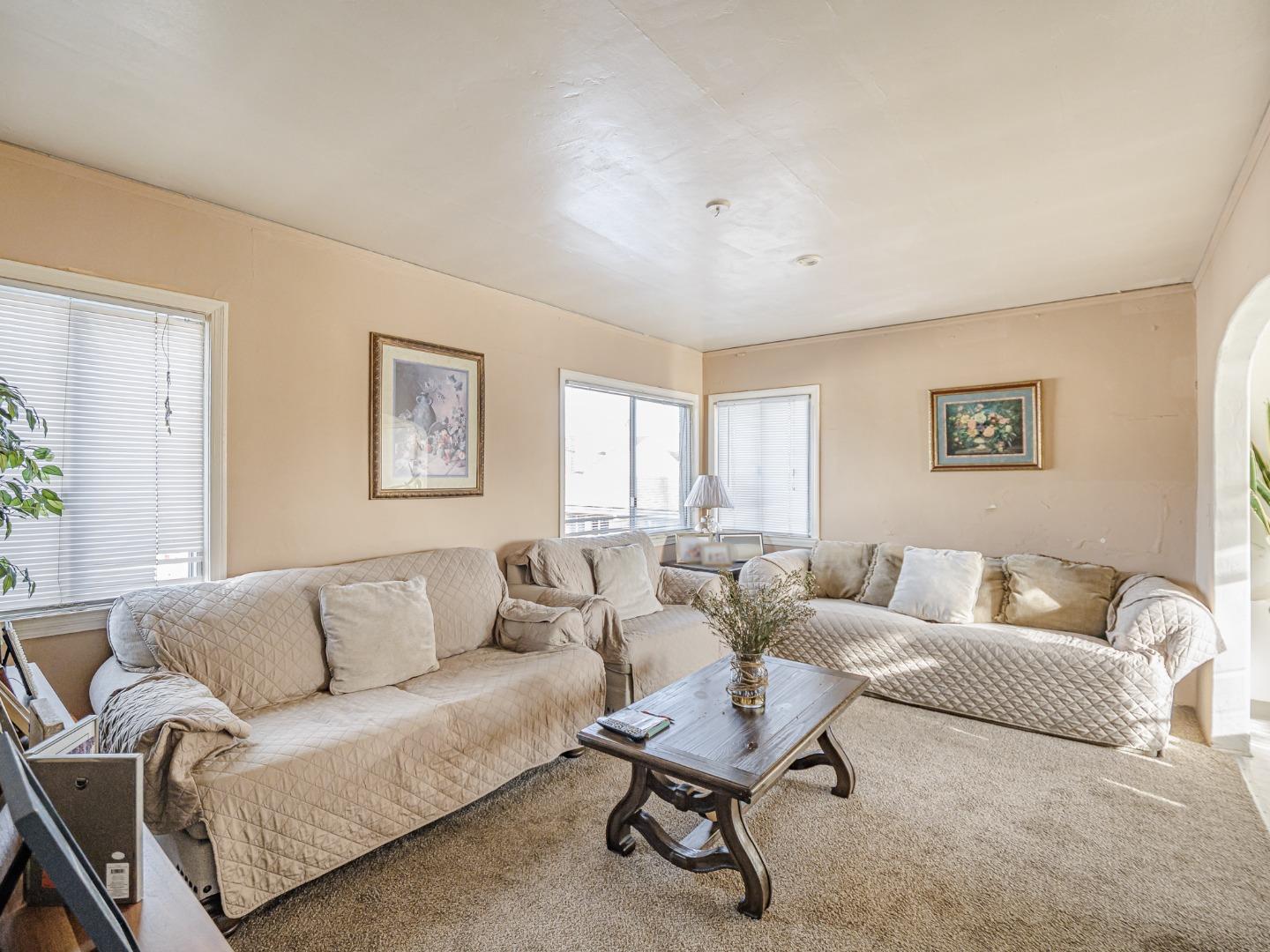 9 Memorial Avenue Freedom, CA 95019 - Photo 10 of 18 a living room with furniture and a large window