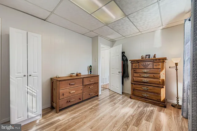 a view of walk in closet with clothes
