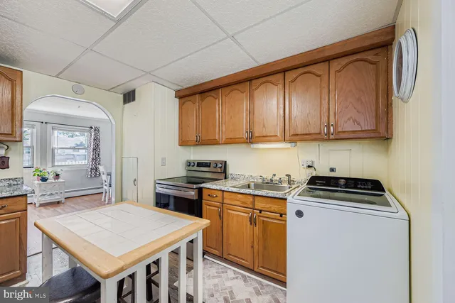 a kitchen that has a cabinets and a stove top oven
