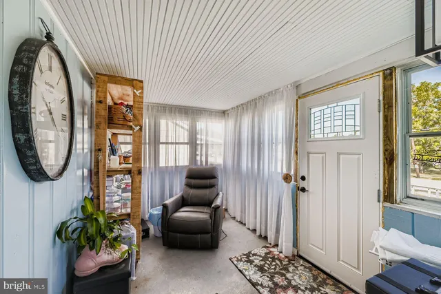 a view of livingroom with furniture and a window