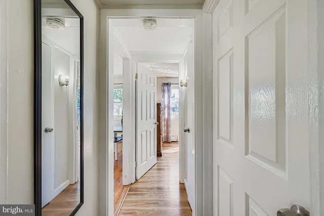 a view of a bathroom from a hallway