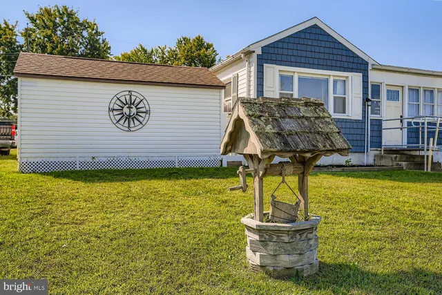 a front view of house with outdoor seating