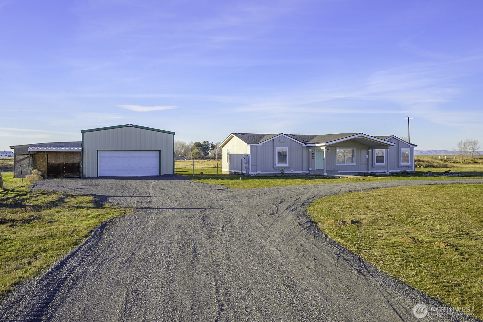 4948 Northeast E 7 Road Moses Lake, WA 98837 - Photo 2 of 22 a swimming pool with outdoor seating