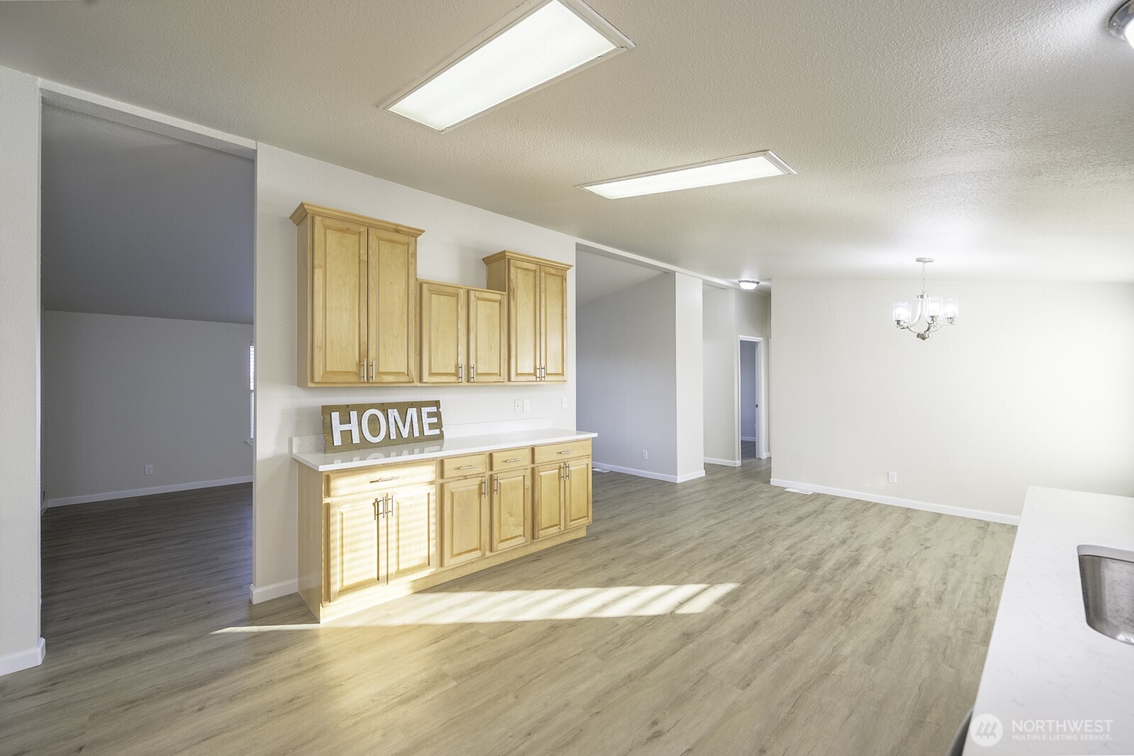 4948 Northeast E 7 Road Moses Lake, WA 98837 - Photo 4 of 22 a view of an empty room with wooden floor and windows