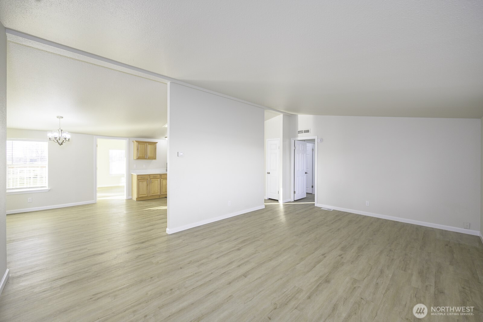 4948 Northeast E 7 Road Moses Lake, WA 98837 - Photo 6 of 22 a view of empty room with wooden floor and window