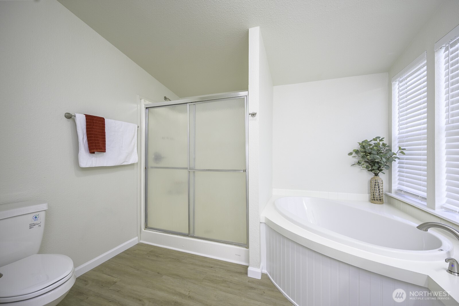 4948 Northeast E 7 Road Moses Lake, WA 98837 - Photo 9 of 22 a white bath tub sitting next to a white toilet