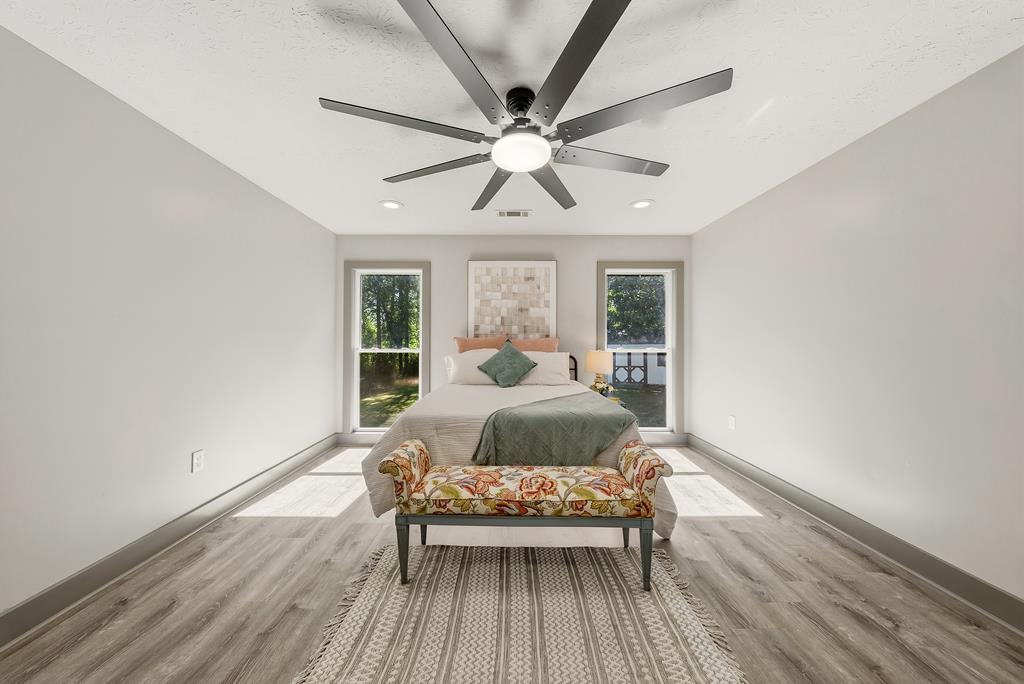 7313 Sesame Street Columbus, GA 31909 - Photo 11 of 43 a bedroom with a bed and wooden floor