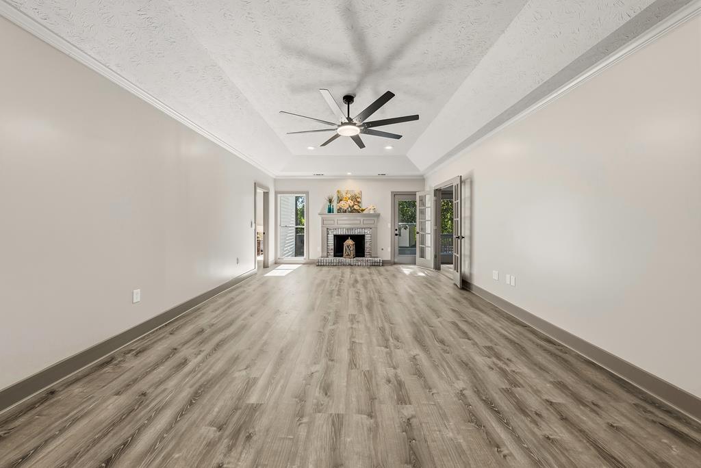 7313 Sesame Street Columbus, GA 31909 - Photo 18 of 43 wooden floor in an empty room with a window
