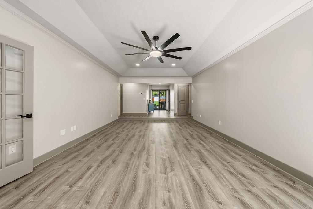 7313 Sesame Street Columbus, GA 31909 - Photo 19 of 43 wooden floor in an empty room with a window