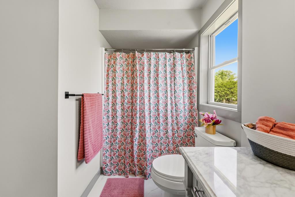 7313 Sesame Street Columbus, GA 31909 - Photo 24 of 43 a bathroom with a sink toilet and shower