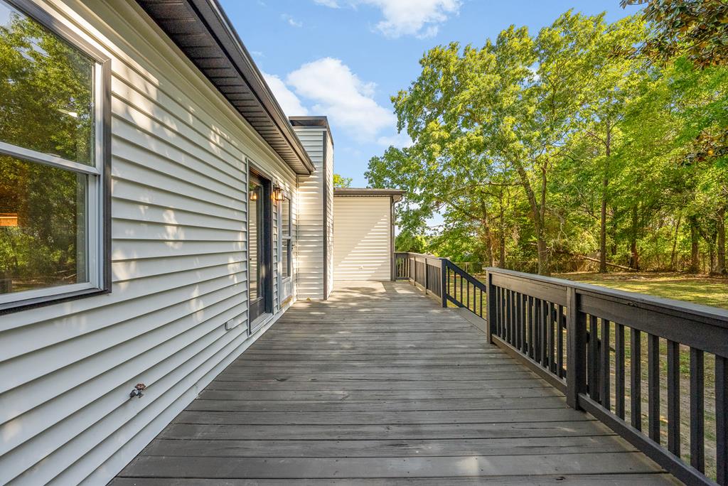 7313 Sesame Street Columbus, GA 31909 - Photo 34 of 43 a view of a balcony with wooden floor