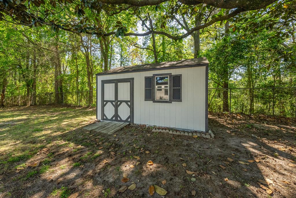 7313 Sesame Street Columbus, GA 31909 - Photo 37 of 43 a backyard of a house with table and chairs