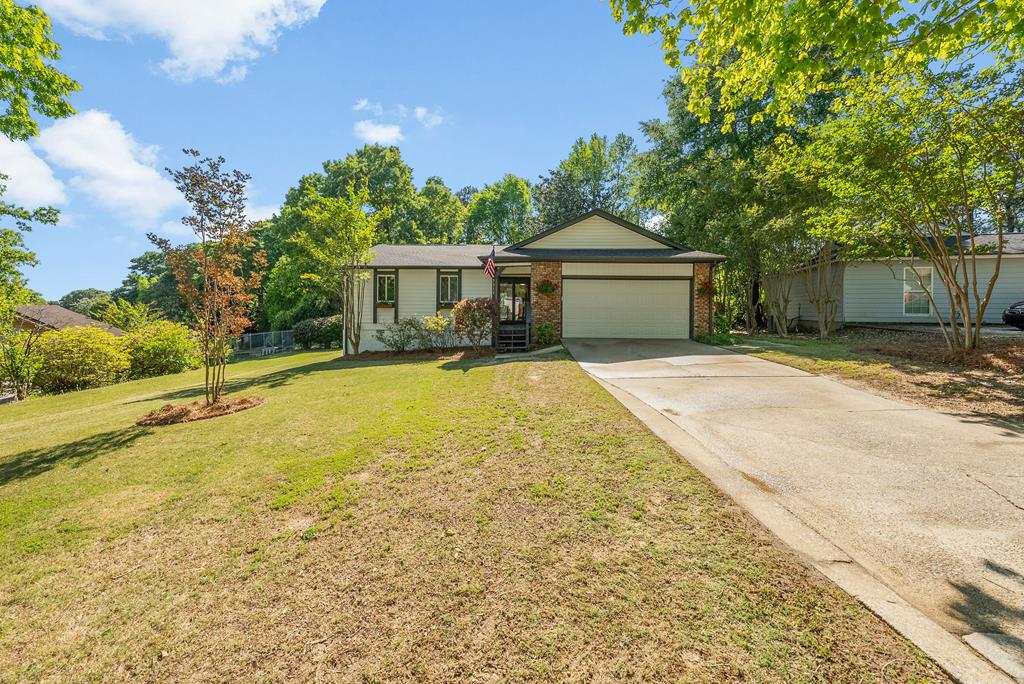 7313 Sesame Street Columbus, GA 31909 - Photo 40 of 43 a view of a house with a yard and large tree