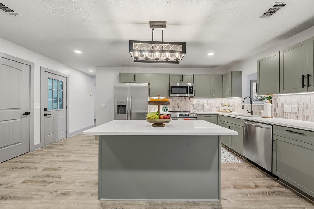 7313 Sesame Street Columbus, GA 31909 - Photo 8 of 43 a view of kitchen with sink refrigerator and microwave