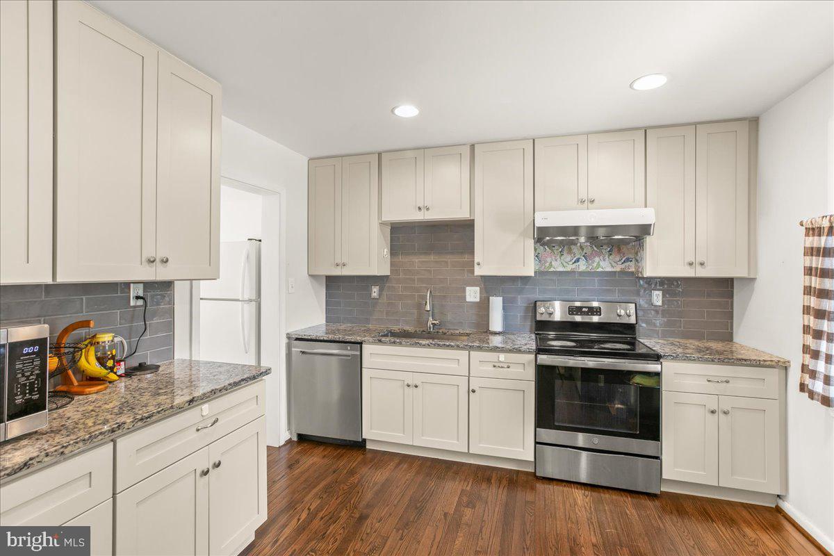 7213 Evanston Road Springfield, VA 22150 - Photo 11 of 37 Modern kitchen with sleek finishes.