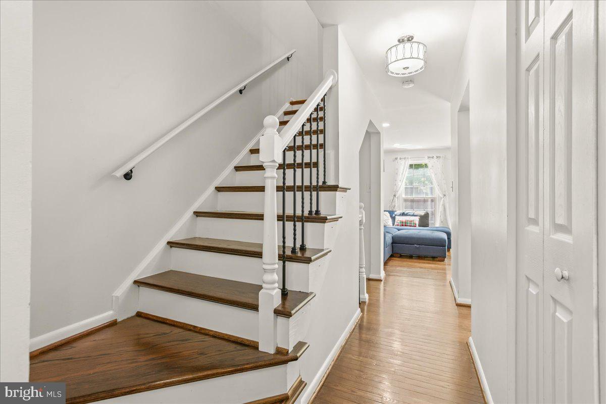 7213 Evanston Road Springfield, VA 22150 - Photo 19 of 37 Inviting hallway with elegant staircase.