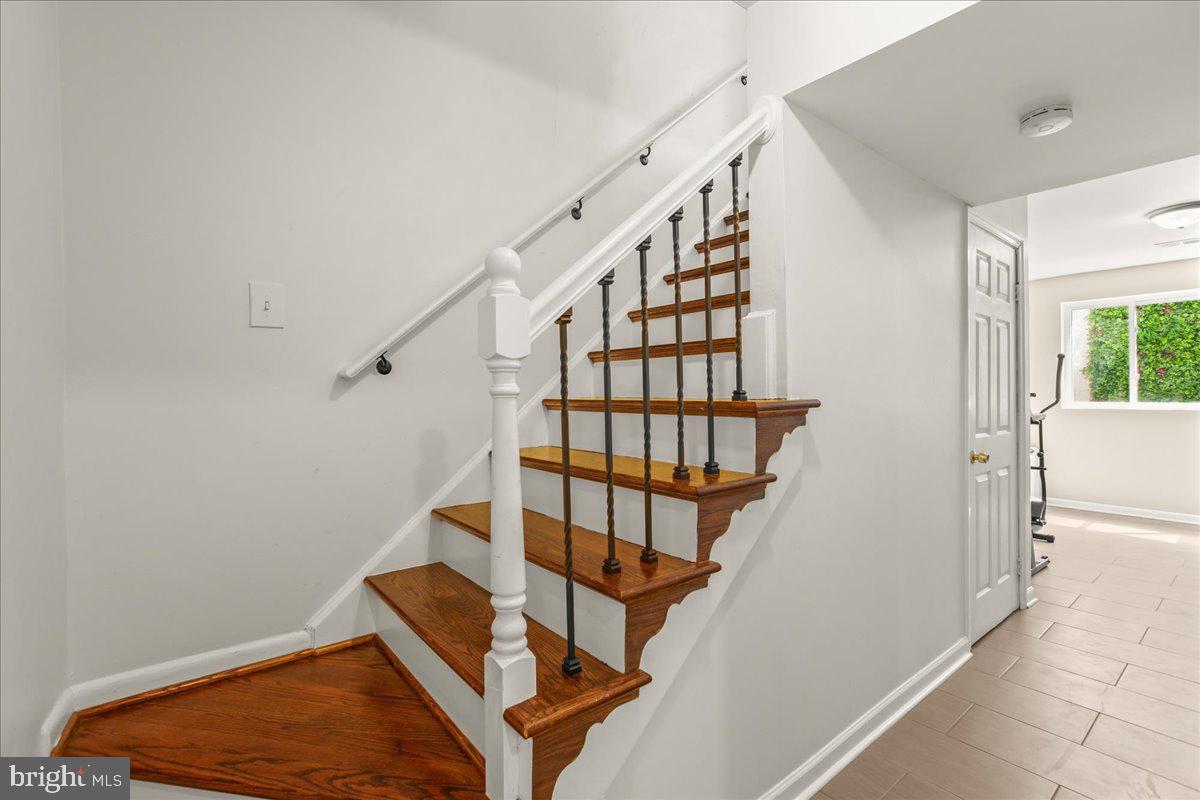 7213 Evanston Road Springfield, VA 22150 - Photo 30 of 37 Elegant staircase with modern railings.