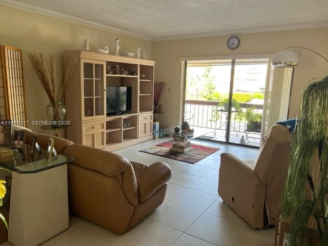 13783 Southwest 66th Street, Unit 215A Miami, FL 33183 - Photo 2 of 13 a living room with furniture and large windows