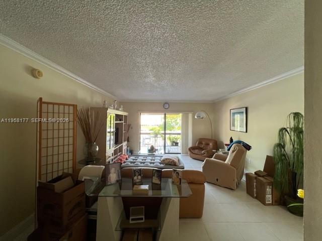 13783 Southwest 66th Street, Unit 215A Miami, FL 33183 - Photo 4 of 13 a living room with furniture and a flat screen tv