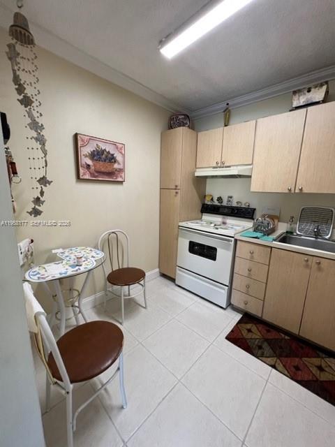 13783 Southwest 66th Street, Unit 215A Miami, FL 33183 - Photo 5 of 13 a kitchen with stainless steel appliances a stove a sink and a refrigerator