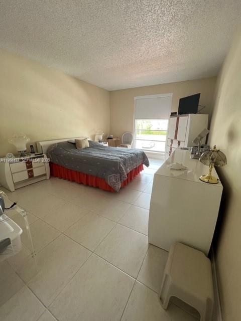 13783 Southwest 66th Street, Unit 215A Miami, FL 33183 - Photo 9 of 13 a bedroom with bed and window