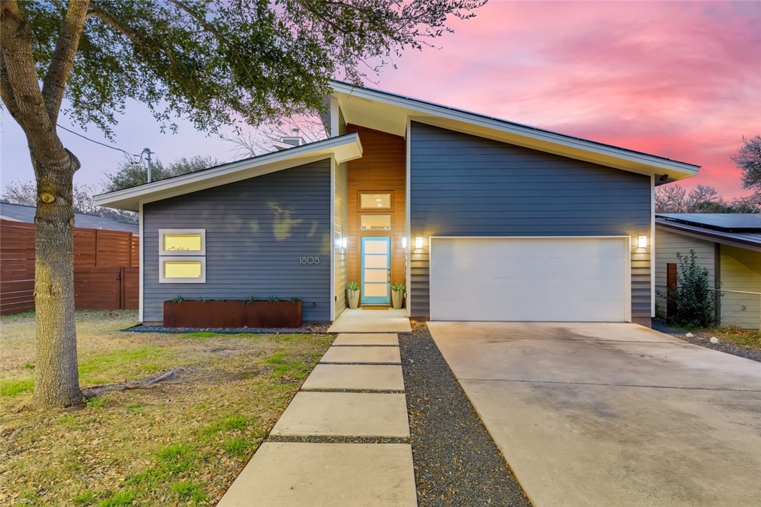 a front view of a house with yard