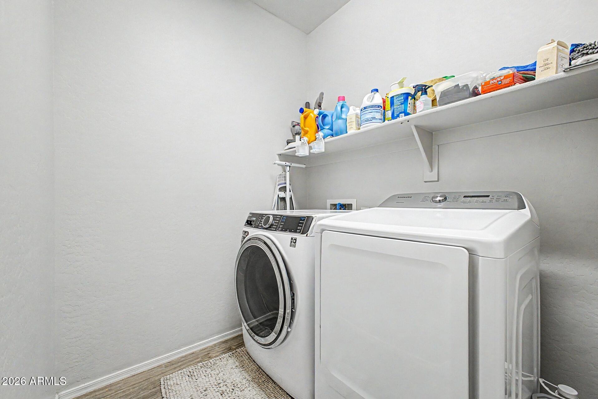 18021 West Indigo Brush Road Goodyear, AZ 85338 - Photo 25 of 47 a utility room with dryer and washer