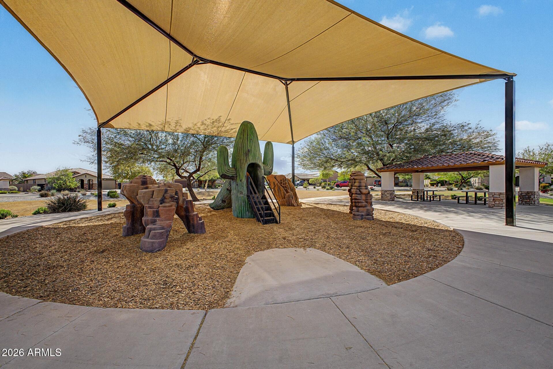 18021 West Indigo Brush Road Goodyear, AZ 85338 - Photo 31 of 47 a view of a park with swings