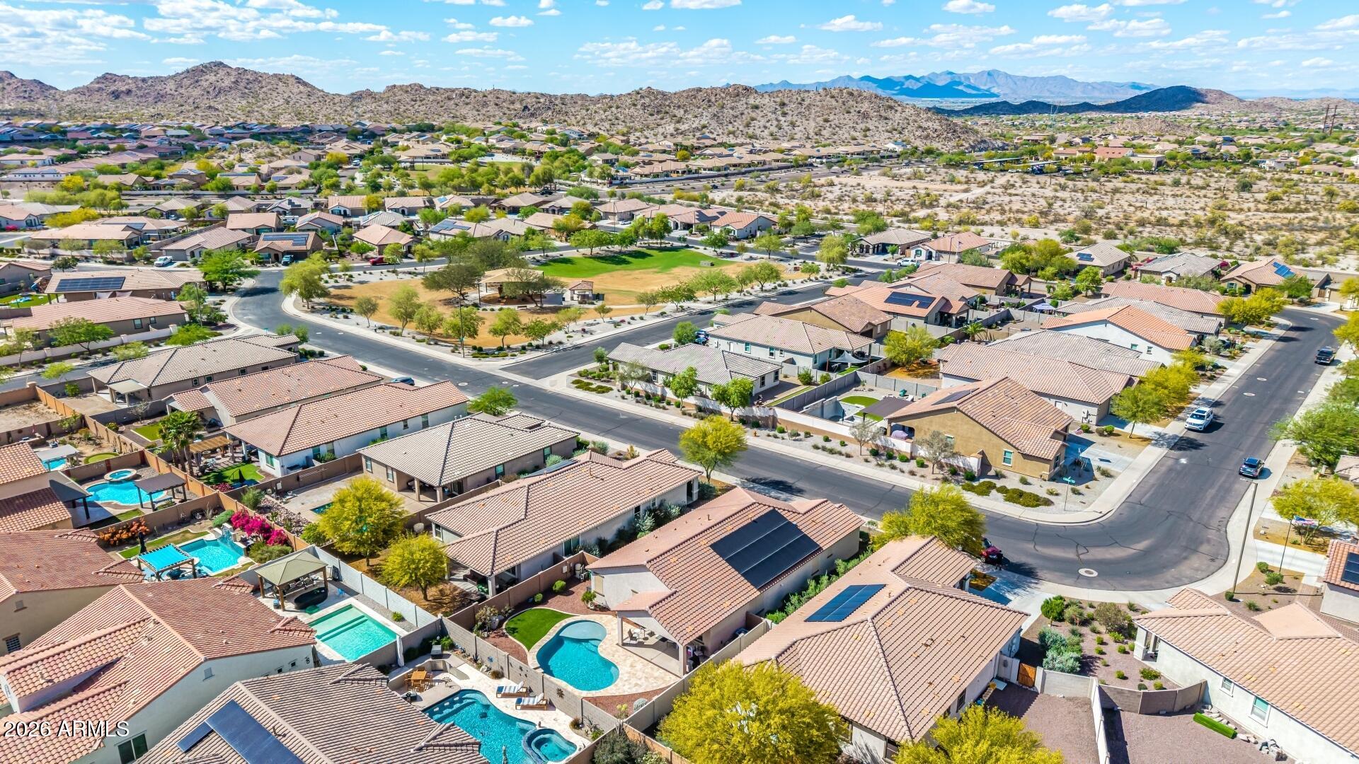 18021 West Indigo Brush Road Goodyear, AZ 85338 - Photo 40 of 47 an aerial view of residential houses with outdoor space