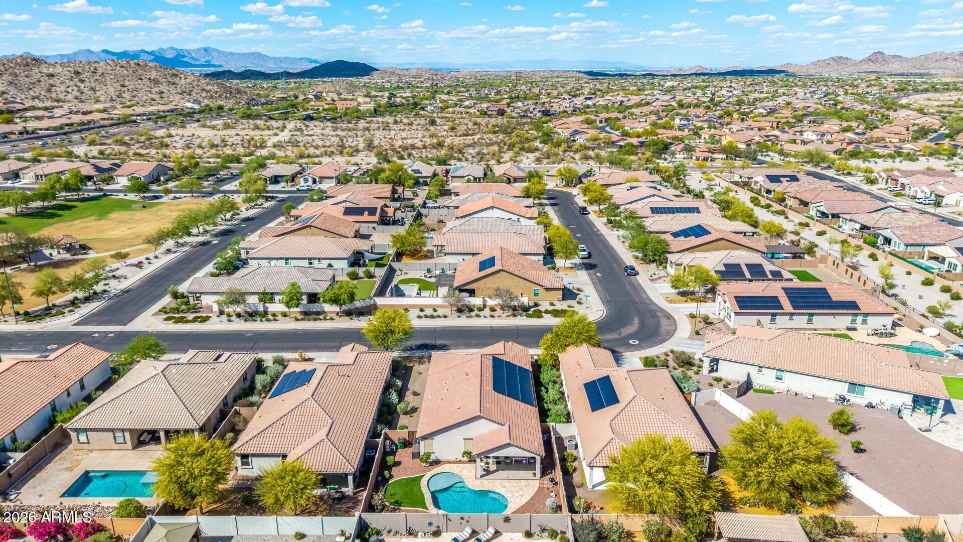 18021 West Indigo Brush Road Goodyear, AZ 85338 - Photo 41 of 47 an aerial view of residential building and lake