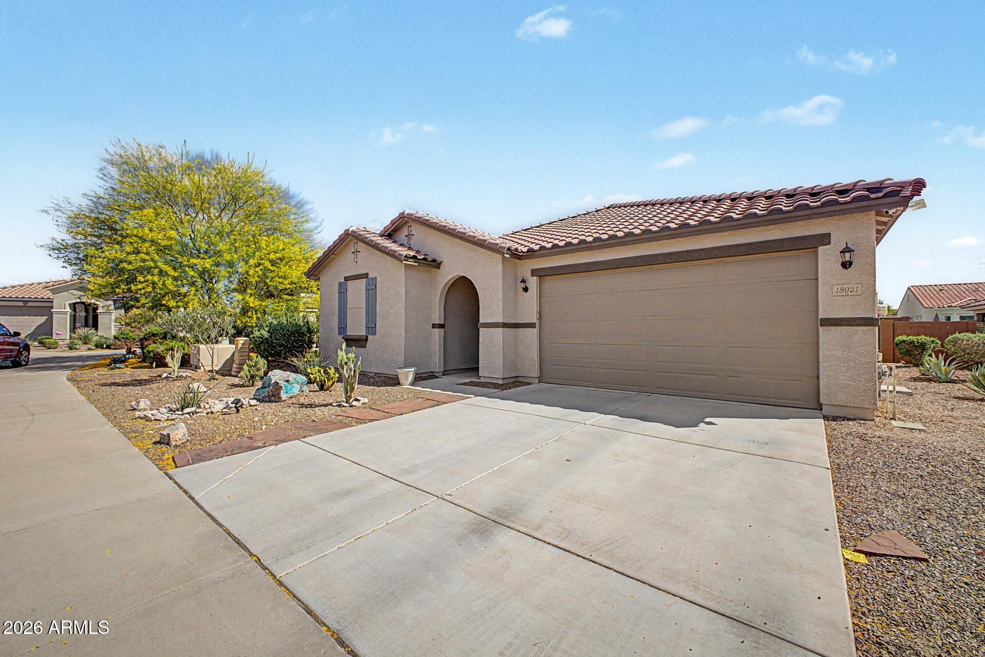 18021 West Indigo Brush Road Goodyear, AZ 85338 - Photo 45 of 47 a view of a house with sitting area and entertaining space