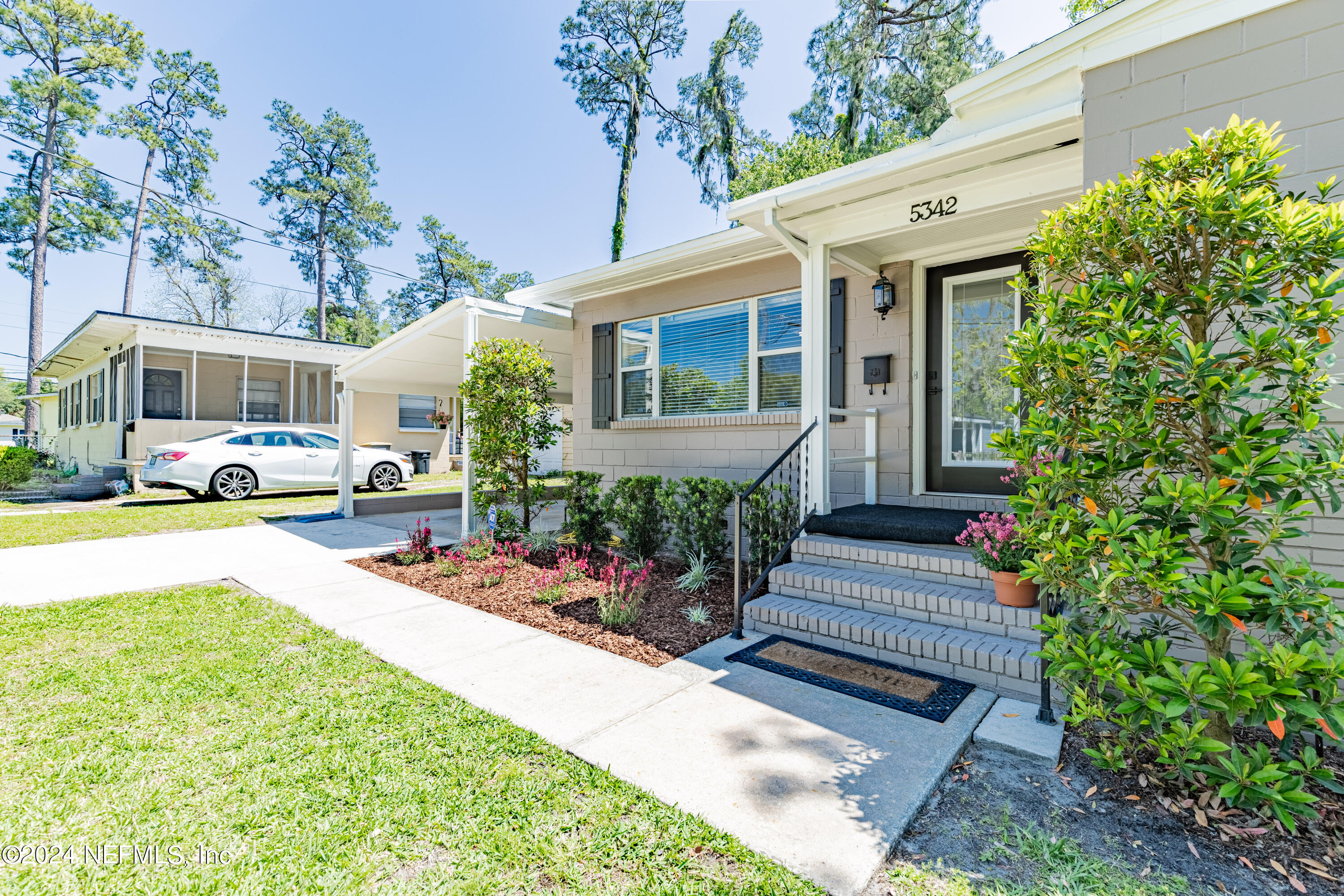 5342 Sharon Terrace Jacksonville, FL 32207 - Photo 3 of 33 a front view of a house with garden and porch