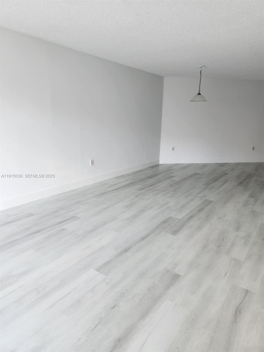 6272 Northwest 186th Street, Unit 201 Hialeah, FL 33015 - Photo 12 of 13 a view of empty room