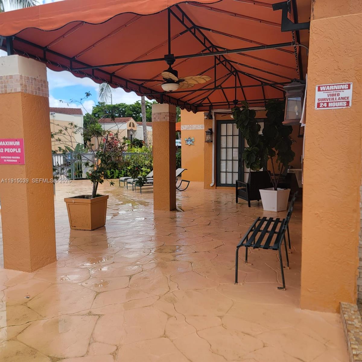6272 Northwest 186th Street, Unit 201 Hialeah, FL 33015 - Photo 2 of 13 a view of a patio with a table and chairs