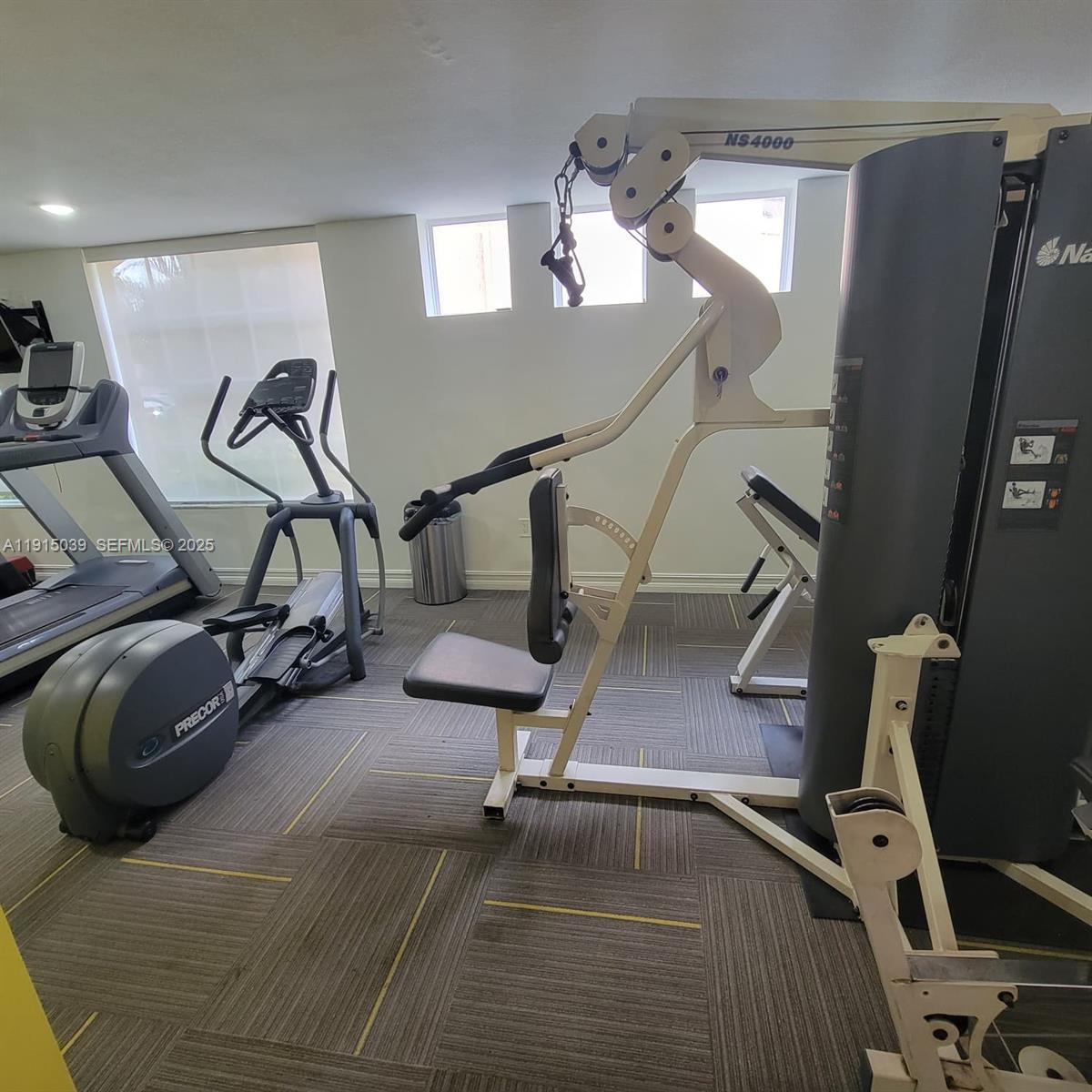 6272 Northwest 186th Street, Unit 201 Hialeah, FL 33015 - Photo 4 of 13 a view of a room with gym equipment