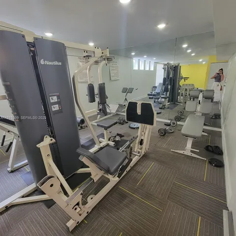 a living room with lots of furniture and a chandelier